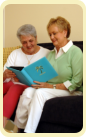 two elderly woman reading