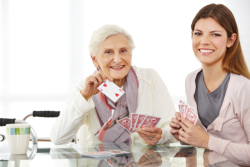 caregiver and patient playing cards