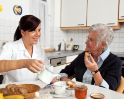 caregiver assisting patient in eating